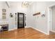 Light and airy foyer boasts sleek, attractive front door and hardwood floors at 500 Katherines Cv, Mcdonough, GA 30253