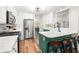 Spacious kitchen with island, seating, stainless steel appliances, white cabinets, quartz countertops, and eat-in nook at 500 Katherines Cv, Mcdonough, GA 30253