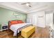 Spacious main bedroom with tray ceiling, ceiling fan, bamboo flooring, and ample closet space at 500 Katherines Cv, Mcdonough, GA 30253