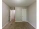 Spacious carpeted bedroom offering a peaceful retreat with neutral walls and ample closet space at 5307 Jay Nw Way, Lilburn, GA 30047