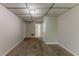 Bedroom with finished ceilings, natural carpeting, and easy access to a closet and bathroom at 5307 Jay Nw Way, Lilburn, GA 30047