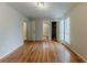 Open bedroom with wood flooring, two windows, and easy access to an attached bath and closet at 5307 Jay Nw Way, Lilburn, GA 30047