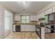 Bright kitchen boasts sleek appliances and abundant cabinetry, offering practicality and style at 5307 Jay Nw Way, Lilburn, GA 30047