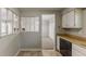 Clean kitchen with wood countertops, well-lit and seamlessly connecting to the living area at 5307 Jay Nw Way, Lilburn, GA 30047