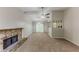 Open living room with a fireplace and a seamless transition to the adjacent dining area at 5307 Jay Nw Way, Lilburn, GA 30047