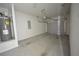 Spacious garage featuring an automatic door opener and a wall-mounted water heater system at 5829 Taka Ln, Lithonia, GA 30038