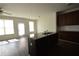 Kitchen island with sink and ample light from windows at 5829 Taka Ln, Lithonia, GA 30038