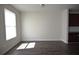 Spacious living room with hardwood floors and natural light from the windows at 5829 Taka Ln, Lithonia, GA 30038