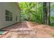 Spacious backyard has a patio and natural surroundings at 6205 Leverett Dr, Lithonia, GA 30038