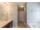 Bright bathroom with vanity, tile floors, and bathtub at 6205 Leverett Dr, Lithonia, GA 30038