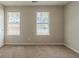 Bright bedroom with plush carpeting and windows offering natural light at 6205 Leverett Dr, Lithonia, GA 30038