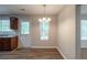 Cozy dining area features a chandelier, wooden-style floors, and easy access to the kitchen at 6205 Leverett Dr, Lithonia, GA 30038