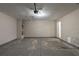 Empty garage with concrete floors, lighting, and connections, ready for use at 6205 Leverett Dr, Lithonia, GA 30038
