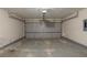 Spacious garage with gray doors and ample room for parking and storage at 6205 Leverett Dr, Lithonia, GA 30038