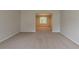 Inviting living room featuring plush carpet and seamless access to the dining area at 6205 Leverett Dr, Lithonia, GA 30038