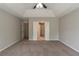 Spacious main bedroom with tray ceiling and plush carpeting at 6205 Leverett Dr, Lithonia, GA 30038