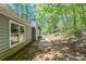 This backyard features a concrete patio, perfect for outdoor seating, dining, and enjoying the outdoors at 1665 Dunbarton Dr, Lithonia, GA 30058
