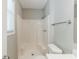 A bathroom featuring a clean white shower, toilet and neutral decor at 1665 Dunbarton Dr, Lithonia, GA 30058