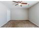 Bright bedroom features carpet flooring, neutral walls, ceiling fan, and closet at 1665 Dunbarton Dr, Lithonia, GA 30058