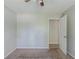 Comfortable bedroom featuring neutral decor, soft carpet and a glimpse into the hallway at 1665 Dunbarton Dr, Lithonia, GA 30058