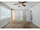 Bedroom with multiple entryways, neutral walls and carpet flooring, creating a versatile space at 1665 Dunbarton Dr, Lithonia, GA 30058