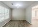 Cozy dining room with hardwood floors and a modern chandelier, perfect for Gathering dinners at 1665 Dunbarton Dr, Lithonia, GA 30058