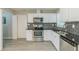 Well-equipped kitchen features stainless steel appliances, granite countertops, and tiled backsplash at 1665 Dunbarton Dr, Lithonia, GA 30058