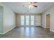 Bright living room with new floors and multiple windows for ample natural light at 1665 Dunbarton Dr, Lithonia, GA 30058