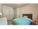 Comfortable bedroom with a bed, soft carpet, and neutral decor, offering a serene and relaxing atmosphere at 1835 Wellston Dr, Lawrenceville, GA 30043