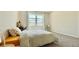 Bright bedroom featuring a large window, carpet flooring, and modern decor, creating a relaxing atmosphere at 1835 Wellston Dr, Lawrenceville, GA 30043