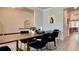 Spacious dining area with wood table, comfortable seating, and light hardwood flooring at 1835 Wellston Dr, Lawrenceville, GA 30043