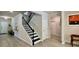 Inviting foyer with a staircase, light hardwood floors, and neutral paint, creating a warm welcome at 1835 Wellston Dr, Lawrenceville, GA 30043