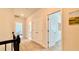 Hallway with neutral tones, closet, and doors leading to various rooms, enhancing the home's modern appeal at 1835 Wellston Dr, Lawrenceville, GA 30043