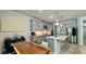 Well-lit kitchen featuring stainless steel appliances, quartz countertops, and a center island with seating at 1835 Wellston Dr, Lawrenceville, GA 30043