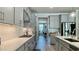 Modern kitchen featuring stainless steel appliances, quartz countertops, and gray cabinets at 1835 Wellston Dr, Lawrenceville, GA 30043
