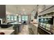 Spacious kitchen with island, stainless steel appliances, and an open layout to the living area at 1835 Wellston Dr, Lawrenceville, GA 30043
