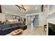 Open living area with a fireplace and a kitchen in the background at 1835 Wellston Dr, Lawrenceville, GA 30043