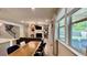 Open living area with large windows, a fireplace, and connection to the backyard at 1835 Wellston Dr, Lawrenceville, GA 30043