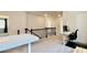 Bright loft area featuring plush carpeting, black wrought iron railing, and versatile space for living or recreation at 1835 Wellston Dr, Lawrenceville, GA 30043