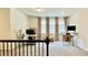 Upstairs loft area featuring a functional workspace with natural light and room to work at 1835 Wellston Dr, Lawrenceville, GA 30043