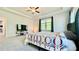 Large main bedroom with tray ceilings, ceiling fan, and large window providing ample light at 1835 Wellston Dr, Lawrenceville, GA 30043