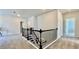 Carpeted stairs with black wrought iron railing leading to upper level, enhancing the home's modern appeal at 1835 Wellston Dr, Lawrenceville, GA 30043