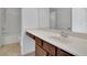 Functional bathroom featuring a vanity with storage, a white countertop, and a shower-tub combination, maximizing space and efficiency at 21 Belmore Manor Dr, Suwanee, GA 30024