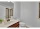 Bright bathroom with a modern sink, wooden vanity, and a glass-enclosed shower, blending style and function at 21 Belmore Manor Dr, Suwanee, GA 30024