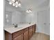 Elegant bathroom with double sinks, ample counter space, and large mirrors, providing a luxurious and functional design at 21 Belmore Manor Dr, Suwanee, GA 30024