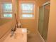 Bathroom with shower and window at 2107 Briarwood Ct, Snellville, GA 30078