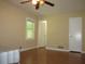 This bedroom has a ceiling fan and a window at 2107 Briarwood Ct, Snellville, GA 30078