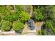 Overhead shot of the house featuring a black roof, driveway, and beautiful surrounding trees at 2295 Piedmont Ridge Ct, Marietta, GA 30062