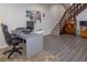 Practical basement office space with desk setup, adjacent to stairs leading to the upper level at 2295 Piedmont Ridge Ct, Marietta, GA 30062