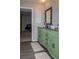 Bathroom with a light green vanity with a brown countertop and hardwood flooring at 2295 Piedmont Ridge Ct, Marietta, GA 30062